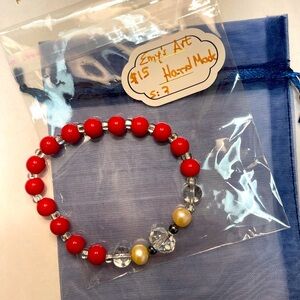 Hand crafted beaded bracelet.  Size 7 red, clear and cream beads